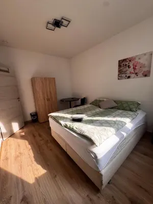 Ein Bett oder Betten in einem Zimmer der Unterkunft A&B Ferienwohnungen