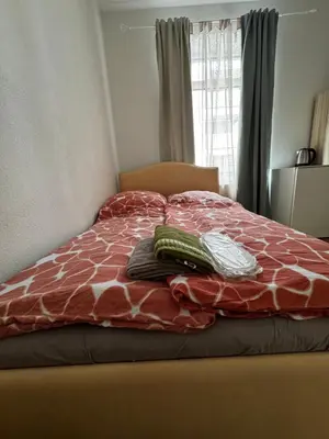 Ein Bett oder Betten in einem Zimmer der Unterkunft A&B Ferienwohnungen
