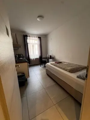 Ein Bett oder Betten in einem Zimmer der Unterkunft A&B Ferienwohnungen