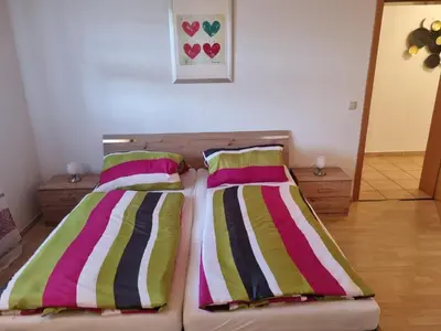 Ein Bett oder Betten in einem Zimmer der Unterkunft Ferienwohnungen März