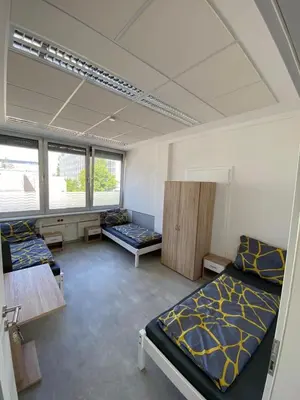 Ein Bett oder Betten in einem Zimmer der Unterkunft Munich Bedrooms