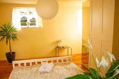Ein Bett oder Betten in einem Zimmer der Unterkunft Vis-à-Vis Schloss Nymphenburg - Rondellapartments