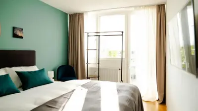 Ein Bett oder Betten in einem Zimmer der Unterkunft Munich City Rooftop Apartment