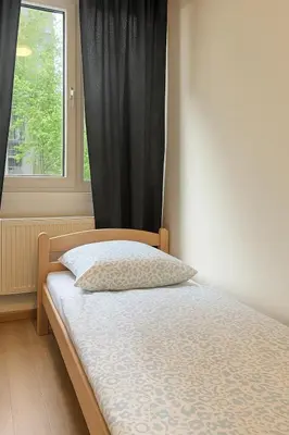 Ein Bett oder Betten in einem Zimmer der Unterkunft NonStop Home