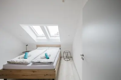 Ein Bett oder Betten in einem Zimmer der Unterkunft Mangfalltal Studios