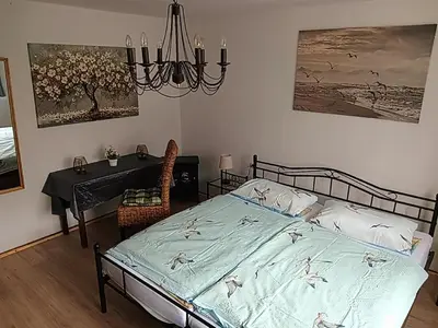 Ein Bett oder Betten in einem Zimmer der Unterkunft Ferienwohnung Dießen Bierdorf - Holzacker