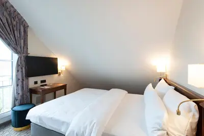 Ein Bett oder Betten in einem Zimmer der Unterkunft AdvaStay by KING's