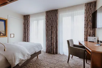 Ein Bett oder Betten in einem Zimmer der Unterkunft AdvaStay by KING's
