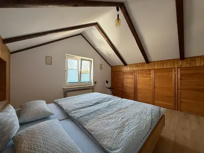Ein Bett oder Betten in einem Zimmer der Unterkunft Ferienwohnung Feßler