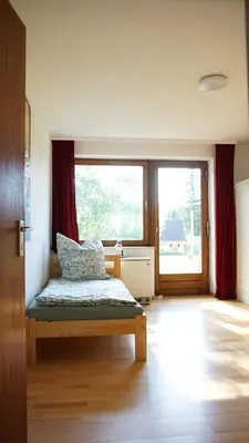 Ein Bett oder Betten in einem Zimmer der Unterkunft Künstlerhaus im Grünen