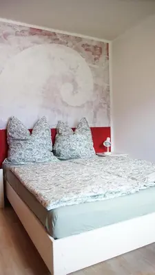 Ein Bett oder Betten in einem Zimmer der Unterkunft Künstlerhaus im Grünen