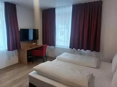 Ein Bett oder Betten in einem Zimmer der Unterkunft Hotel Stern