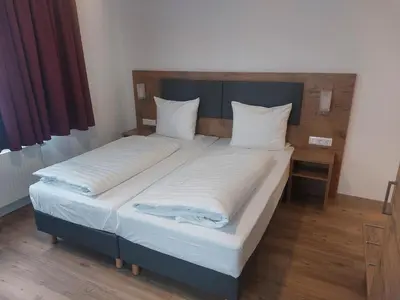 Ein Bett oder Betten in einem Zimmer der Unterkunft Hotel Stern