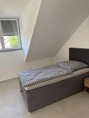 Ein Bett oder Betten in einem Zimmer der Unterkunft Boardinghaus Koucha - Wohnen auf Zeit