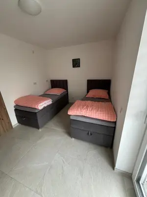 Ein Bett oder Betten in einem Zimmer der Unterkunft Boardinghaus Koucha - Wohnen auf Zeit