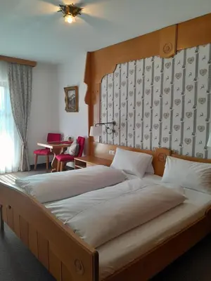 Ein Bett oder Betten in einem Zimmer der Unterkunft Gästehaus Zunterer