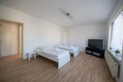 Ein Bett oder Betten in einem Zimmer der Unterkunft WundP Living Wohnung mit Terrasse Parkplatz