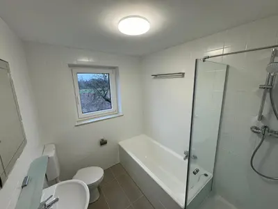 Ein Badezimmer in der Unterkunft WundP Living Wohnung mit Terrasse Parkplatz