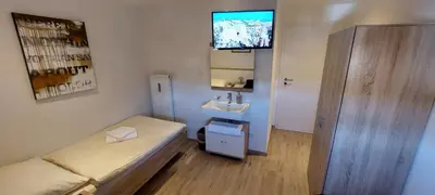 Ein Bett oder Betten in einem Zimmer der Unterkunft Feriensuite Romeo Mittenwald