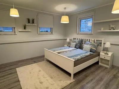 Ein Bett oder Betten in einem Zimmer der Unterkunft Ferienwohnung Landshut am Gambach
