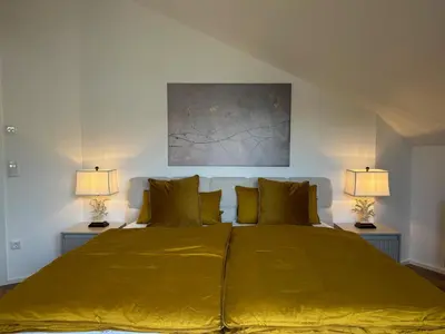 Ein Bett oder Betten in einem Zimmer der Unterkunft Bergzauber Suite