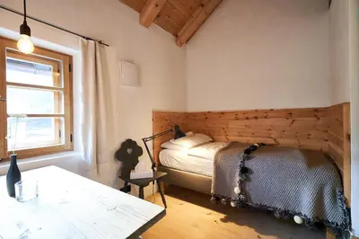 Ein Bett oder Betten in einem Zimmer der Unterkunft WASCHHAUS - Ferienhaus in Grassau im Chiemgau