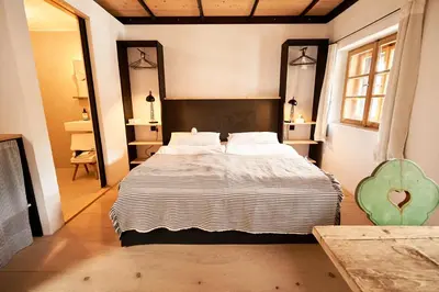 Ein Bett oder Betten in einem Zimmer der Unterkunft WASCHHAUS - Ferienhaus in Grassau im Chiemgau