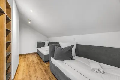 Ein Bett oder Betten in einem Zimmer der Unterkunft Creativ Wohnen Apartmenthaus Forstinning