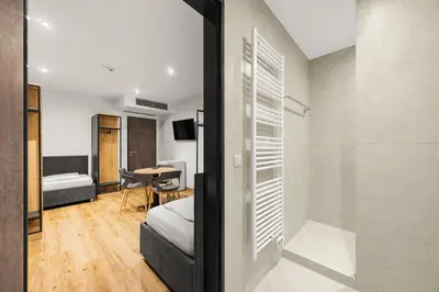 Ein Bett oder Betten in einem Zimmer der Unterkunft Creativ Wohnen Apartmenthaus Forstinning