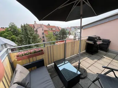 Ein Balkon oder eine Terrasse in der Unterkunft City-Apartment with private Rooftop Terrace