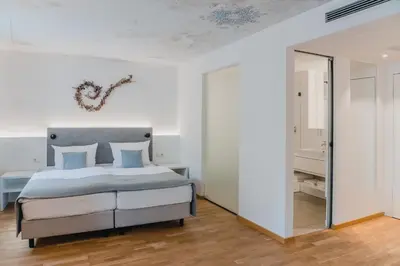 Ein Bett oder Betten in einem Zimmer der Unterkunft Aktiv Hotel am Inn