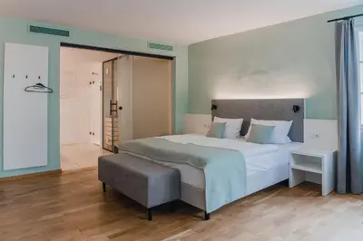 Ein Bett oder Betten in einem Zimmer der Unterkunft Aktiv Hotel am Inn