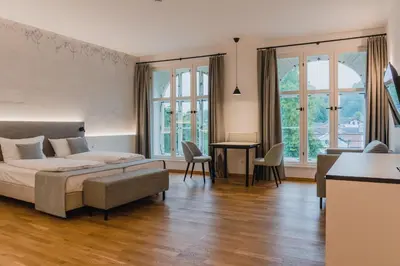 Ein Bett oder Betten in einem Zimmer der Unterkunft Aktiv Hotel am Inn