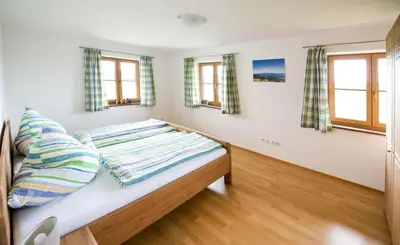 Ein Bett oder Betten in einem Zimmer der Unterkunft Ferienwohnung Zugspitze