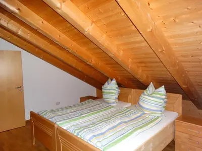 Ein Bett oder Betten in einem Zimmer der Unterkunft Ferienwohnung Wallberg