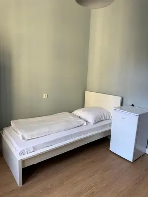 Ein Bett oder Betten in einem Zimmer der Unterkunft 1, 2, sleep Boardinghouse München Hauptbahnhof