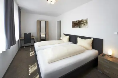 Ein Bett oder Betten in einem Zimmer der Unterkunft Hotel New In Guesthouse