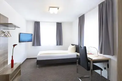 Ein Bett oder Betten in einem Zimmer der Unterkunft Hotel New In Guesthouse
