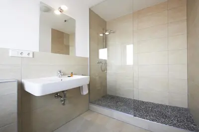 Ein Badezimmer in der Unterkunft Hotel New In Guesthouse