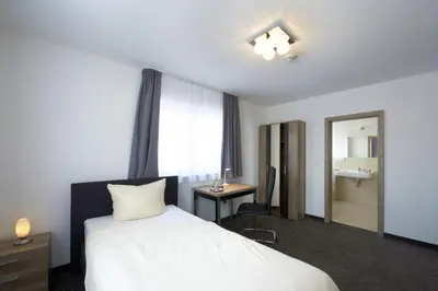 Ein Bett oder Betten in einem Zimmer der Unterkunft Hotel New In Guesthouse