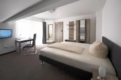 Ein Bett oder Betten in einem Zimmer der Unterkunft Hotel New In Guesthouse