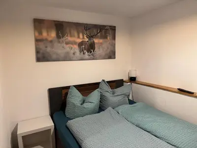 Ein Bett oder Betten in einem Zimmer der Unterkunft Haus Monika - wunderschöne ruhige Wohnung
