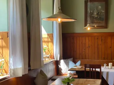 Ein Sitzbereich in der Unterkunft Gasthof Großer Wirt