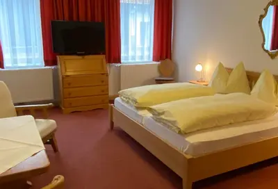 Ein Bett oder Betten in einem Zimmer der Unterkunft Gasthof Großer Wirt