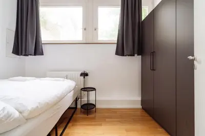 Ein Bett oder Betten in einem Zimmer der Unterkunft MARAL Loft München Bogenhausen