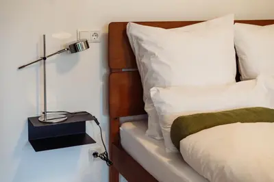Ein Bett oder Betten in einem Zimmer der Unterkunft MARAL Loft München Bogenhausen