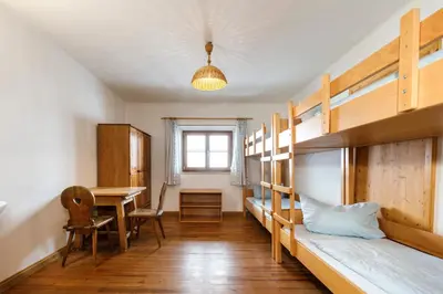 Ein Bett oder Betten in einem Zimmer der Unterkunft Jugendherberge Bayrischzell-Sudelfeld