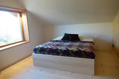Ein Bett oder Betten in einem Zimmer der Unterkunft Architect-designed house near Lake Chiemsee