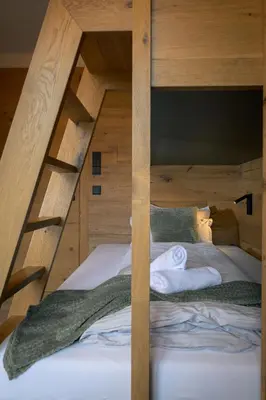 Ein Bett oder Betten in einem Zimmer der Unterkunft Boutique ChaletS Alpi - Private Sauna & Garden