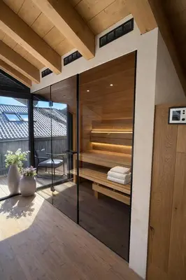 Ein Bett oder Betten in einem Zimmer der Unterkunft Boutique ChaletS Alpi - Private Sauna & Garden